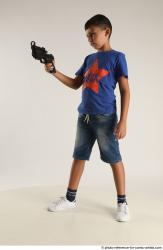 TIMBO STANDING POSE WITH GUN